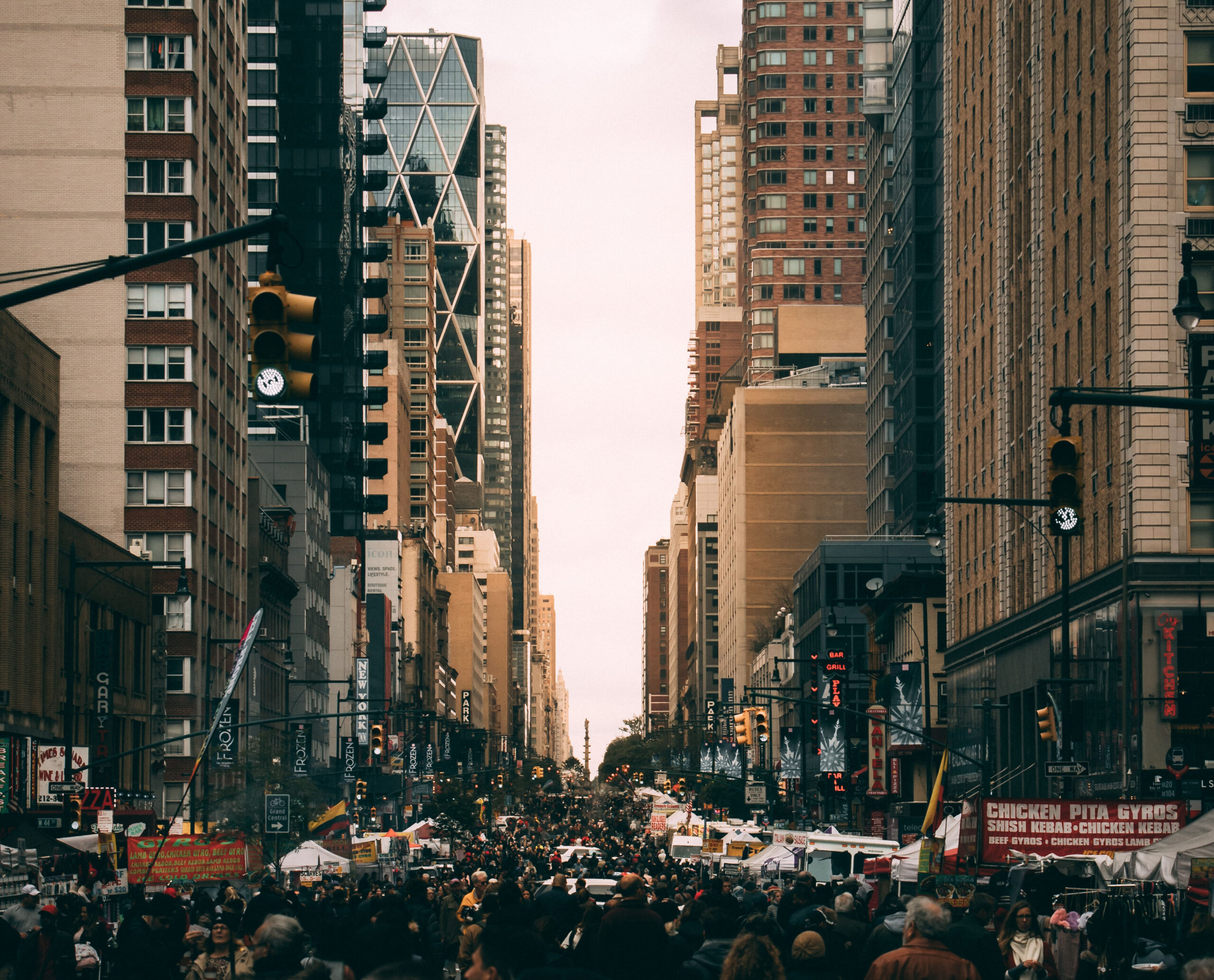 Wide image of a busy New York City street