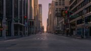 gray concrete road between buildings